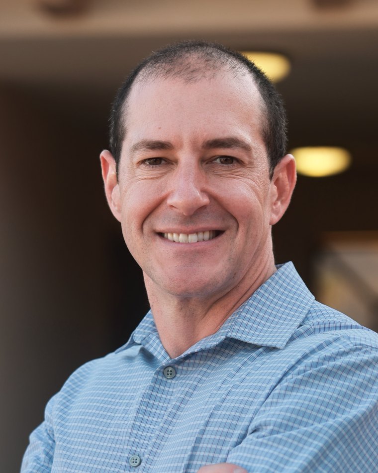 Peter O'Brien, NP, founder of Go Time Health, in scrubs